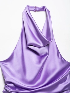 Detail of a purple satin halter neck top featuring elegant cowl neckline and back buttons