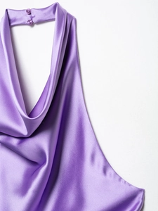 Detailed close-up of dark purple satin cowl neck dress with elegant back buttons