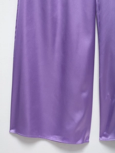 Detail of purple satin fabric texture with elegant sheen and high-quality stitching