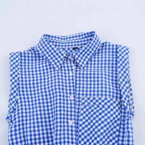 Sleepless blue and white plaid romper with seersucker texture and button-up front design