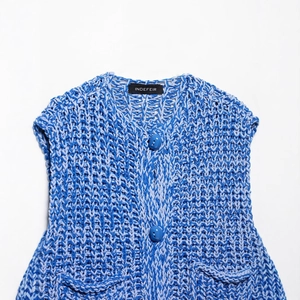 Sleeveless chunky knit vest for women in blue mixed yarn with two front buttons