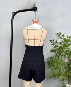 Detail of navy two-piece set with halter neck top, shorts and sailor collar accessory