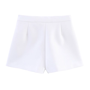 Detailed view of high-waisted white wide-leg shorts with precise tailoring and pleats