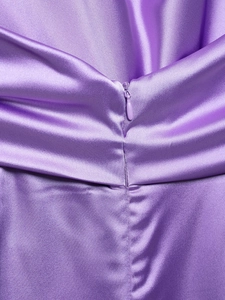 Detail of lavender purple satin jumpsuit showing high-quality matching invisible zipper