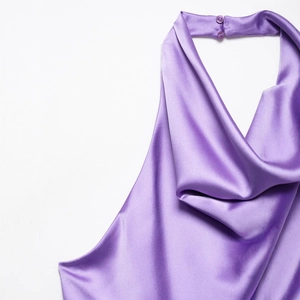 Elegant purple halter neck satin jumpsuit with glossy drape and button closure