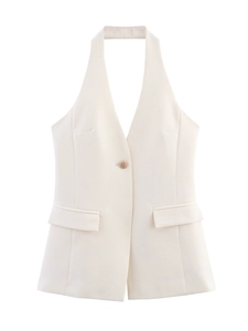 Detailed view of beige halter vest featuring a single gold button and flap pockets