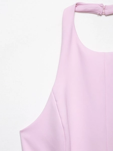 Detail shot of the back neck closure with small button on a pink halter neck top