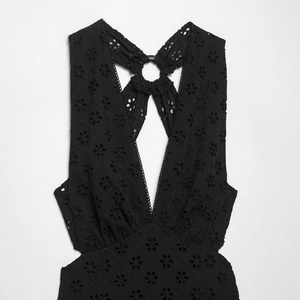 Women's black eyelet embroidery halter dress with deep V-neck and metal ring detail