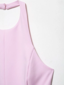Detail of pink halter top showing the neck button closure and neat stitching