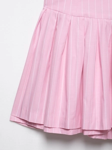 Detail view of pink and white striped pleated fabric texture and craftsmanship