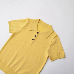 Bright yellow short-sleeved knitted polo shirt with classic collar and ribbed edges