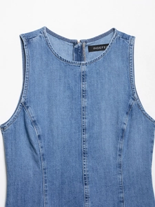 Detail view of light blue denim sleeveless dress with round neck and back zipper closure