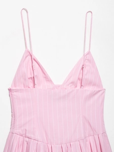 Detail view of pink striped dress with adjustable spaghetti straps and side zipper