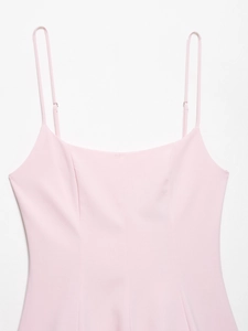 Close-up of pink adjustable spaghetti straps and smooth neckline on a summer dress
