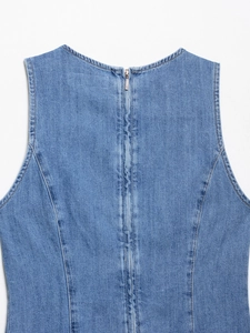 Detail view of light blue denim sleeveless dress with high-quality back metal zipper