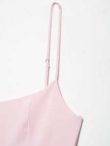 Close-up of pink dress with adjustable spaghetti straps and silver metal buckles