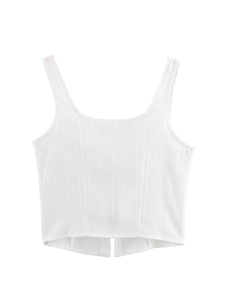 Close-up of white ribbed crop top featuring front tie design and soft elastic fabric