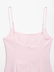 Detail of light pink summer dress featuring slim adjustable straps and a hidden back zipper
