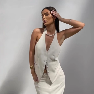 Elegant white halter neck vest for women featuring a V-neck button design and slim fit