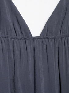 Detail of the deep V-neckline and elastic pleated waist on this dark grey blue summer dress