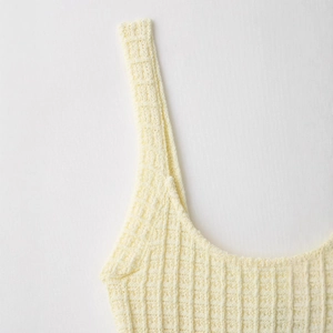 Elegant knit bodycon dress in pale yellow with vertical ribbed waffle texture detail