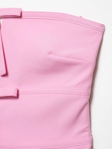 Close-up of pink strapless top showing twill fabric texture and reinforced stitching