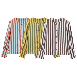 Detail showing red, yellow, and brown striped casual shirts with puff sleeves and buttons