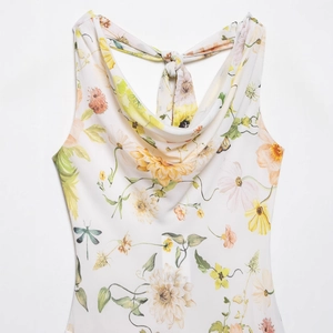 Women's summer cowl neck dress featuring floral print and elegant back tie details