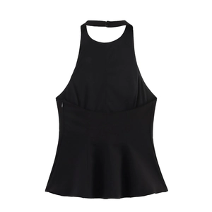 Detail of black halter top with peplum hem and backless design in soft fabric