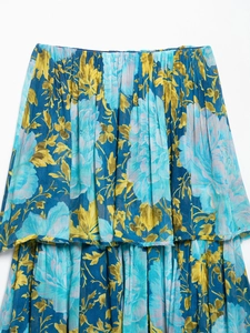 Detailed macro view of floral chiffon fabric layers with elastic pleated waistline details