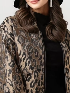 Close-up of leopard print jacket with zipper and textured fabric for women