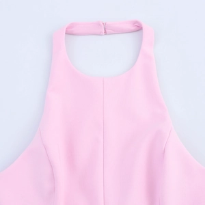 Close-up of pink halter neck top showing secure neck closure and high-quality fabric detail