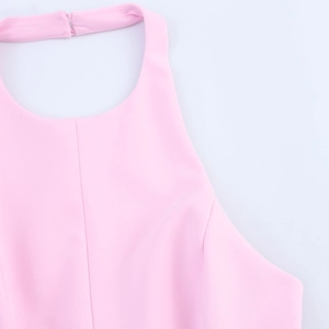 Close-up detail of a pink halter top showing the back neck closure and smooth fabric texture