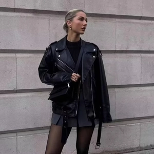 Oversized black PU leather biker jacket with metallic zippers and waist belt for women