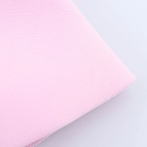 Close-up of soft pink fabric with high-density knit texture and subtle sheen