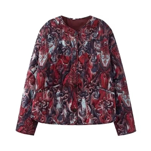 Detail of vintage abstract print quilted jacket with button-up front and side pockets