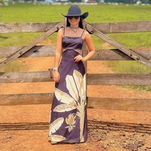 Black backless maxi dress with tropical banana leaf print and waist cut-out detail