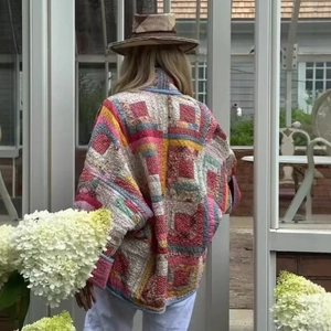Women's vintage patchwork quilted jacket with bohemian embroidery in garden setting