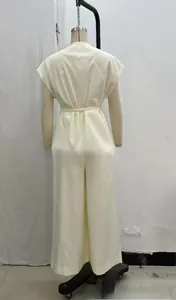 Back view of a sleeveless tie-waist top and wide-leg trousers in creamy white color