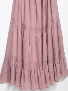Detail of dusty pink tiered midi skirt with natural crinkled cotton linen texture and drawstring