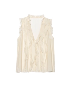 Detailed close-up of sleeveless milk-white chiffon blouse with V-neck and ruffled edges