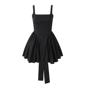 Elegant black sleeveless bow-back dress with pleated puff skirt and long ribbons