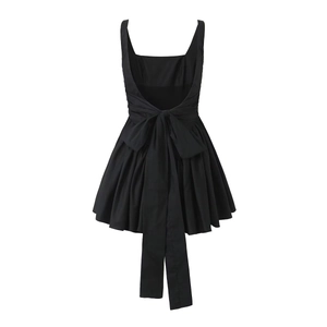 Women's black sleeveless mini dress featuring a large bow tie and open back design