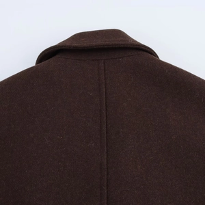 Detailed macro view of the dark brown wool coat back collar and fine stitching texture