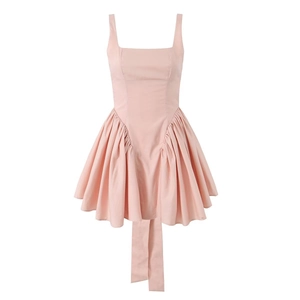 Pink sleeveless bow tie back dress with structured bodice and layered pleated A-line skirt