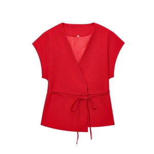 Detailed view of red sleeveless V-neck vest with waist tie and smooth inner lining
