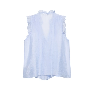 Detail of light blue sleeveless top featuring a deep V-neck and ruffle layer accents