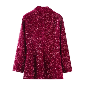 Close-up of sparkling magenta sequins and detailed stitching on the sequin blazer jacket