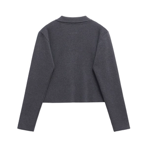Back view of a dark grey cropped knitted jacket with a lapel collar and long sleeves