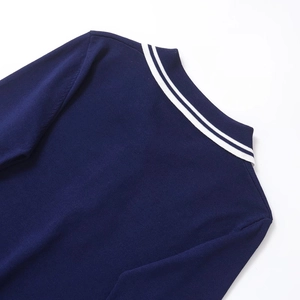 Haut en maille bleu marine à manches longues pour femme avec col polo à double rayure